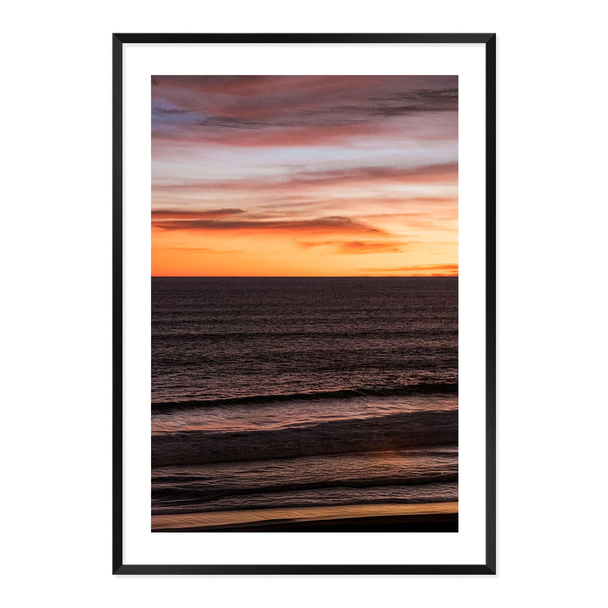 Framed artwork of a sunset over water with a black frame.