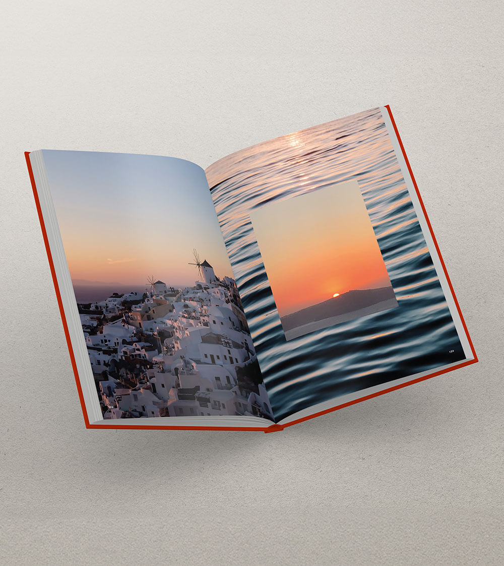 Open coffee table book featuring images of the Greek Islands