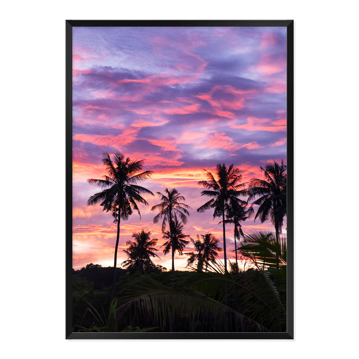 Framed artwork of palm trees against a vibrant purple and pink sunset sky.