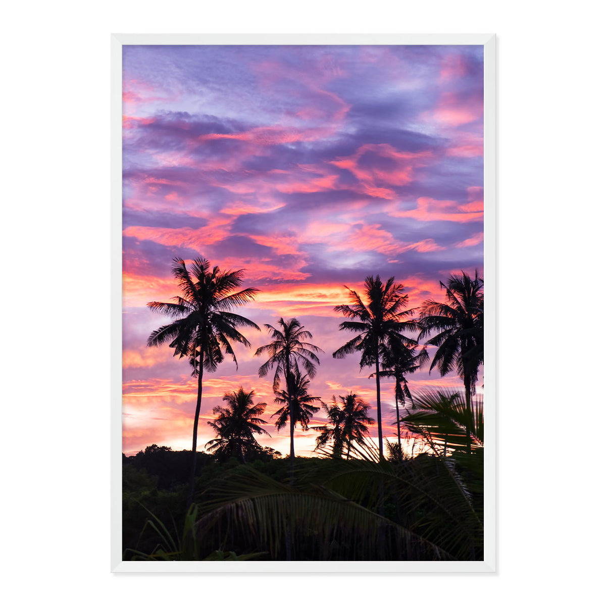 Framed artwork of palm trees against a vibrant purple and pink sunset sky.