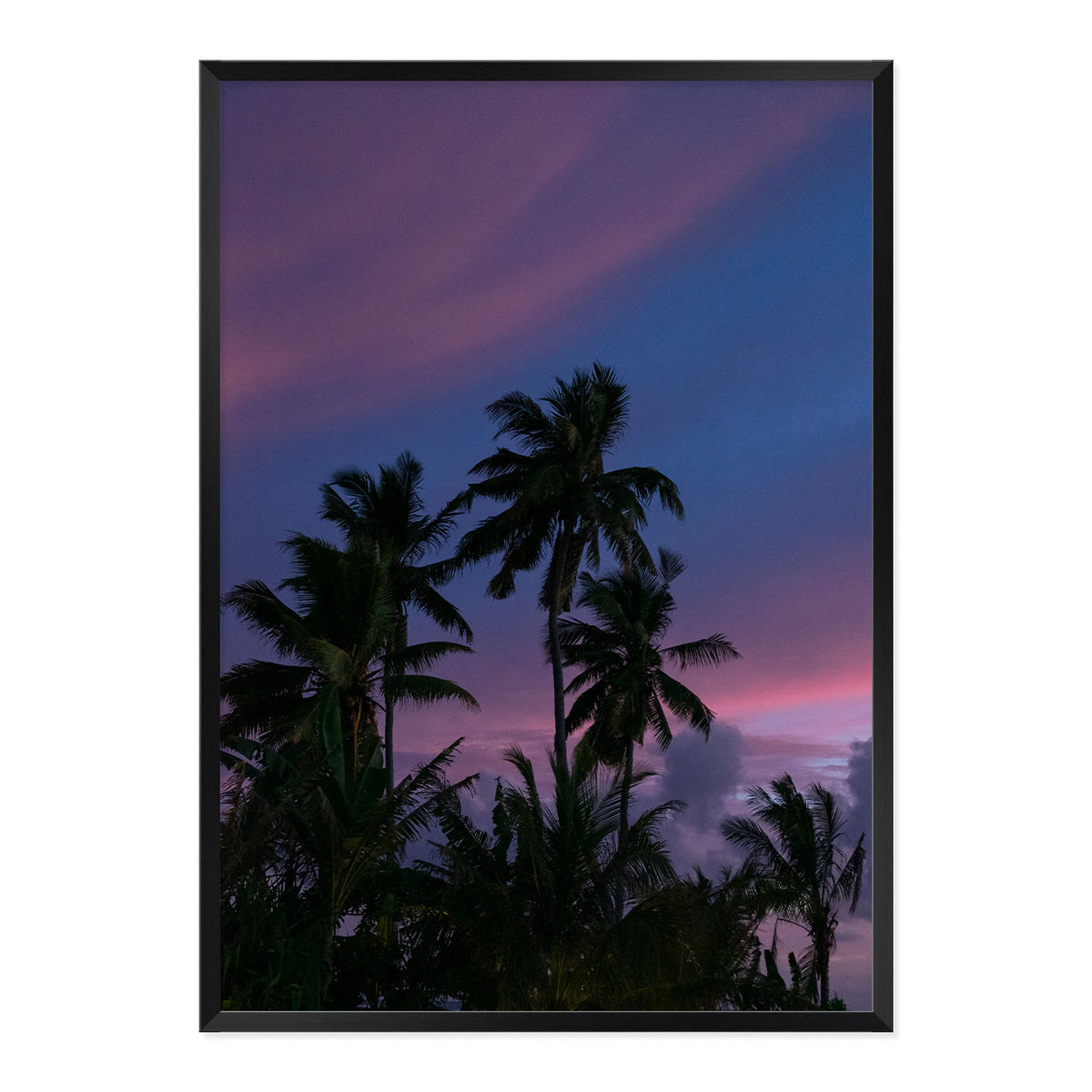 Framed artwork of palm trees against a purple sky