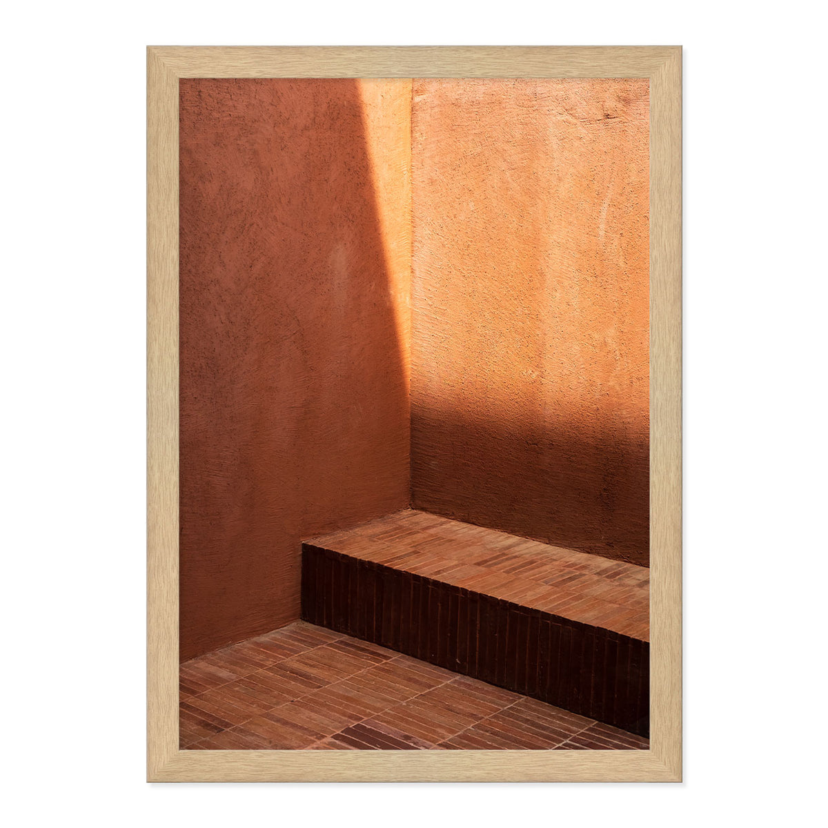 Wooden framed photograph of a sunlit room with a wooden floor and wall.