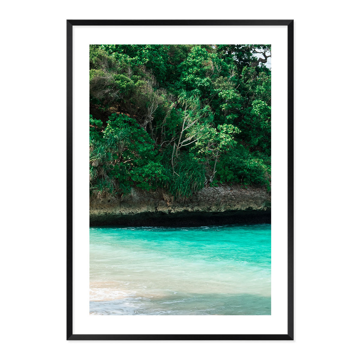 Framed artwork of a tropical landscape with greenery and turquoise water.