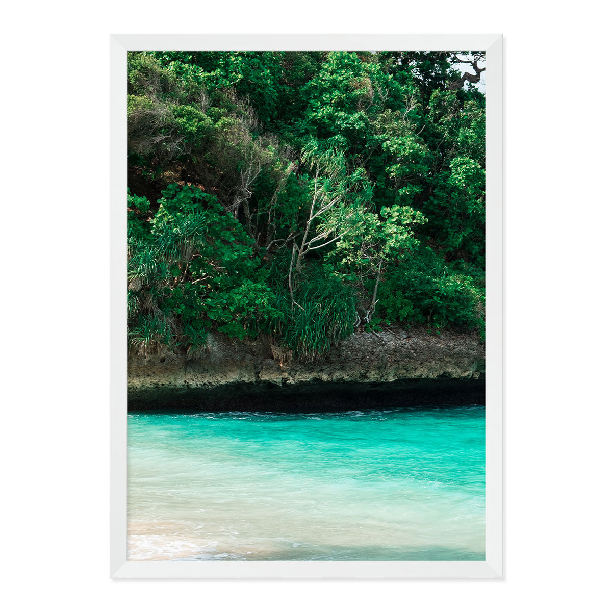 Framed artwork of a tropical landscape with greenery and turquoise water.